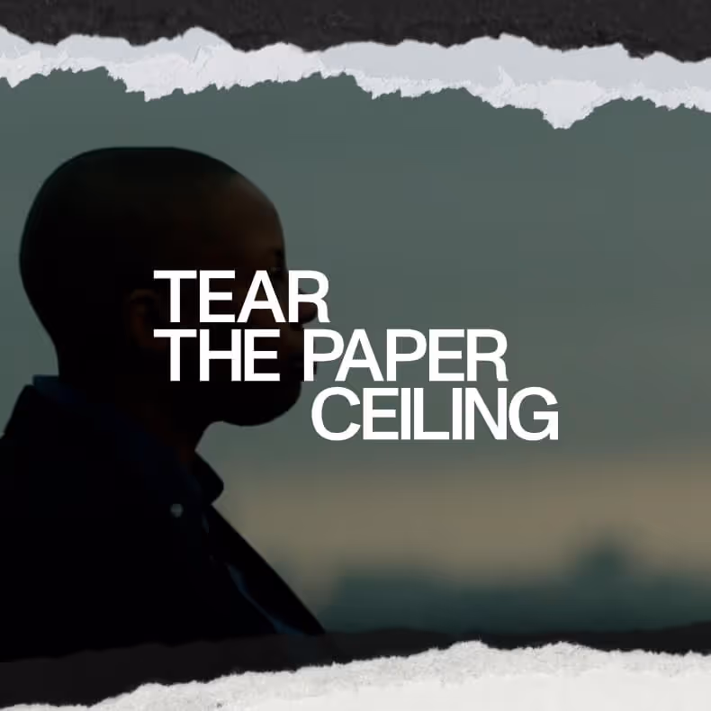 Silhouette of a person against a dark background with torn paper edges and text reading 'TEAR THE PAPER CEILING'.