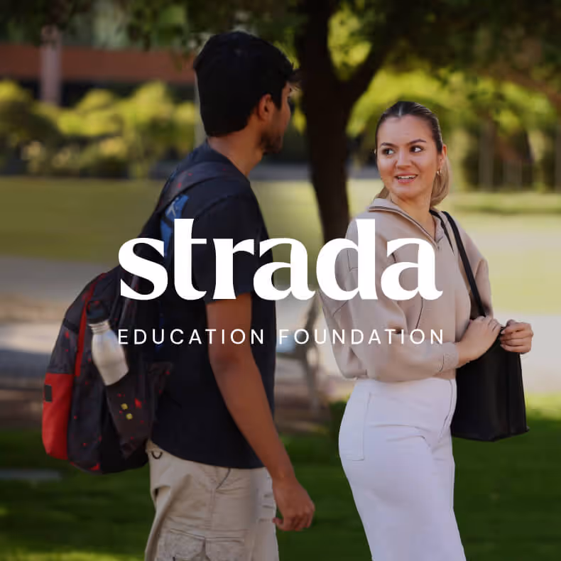 Two young adults smiling and talking outdoors in a park-like setting, with 'strada Education Foundation' text overlay.